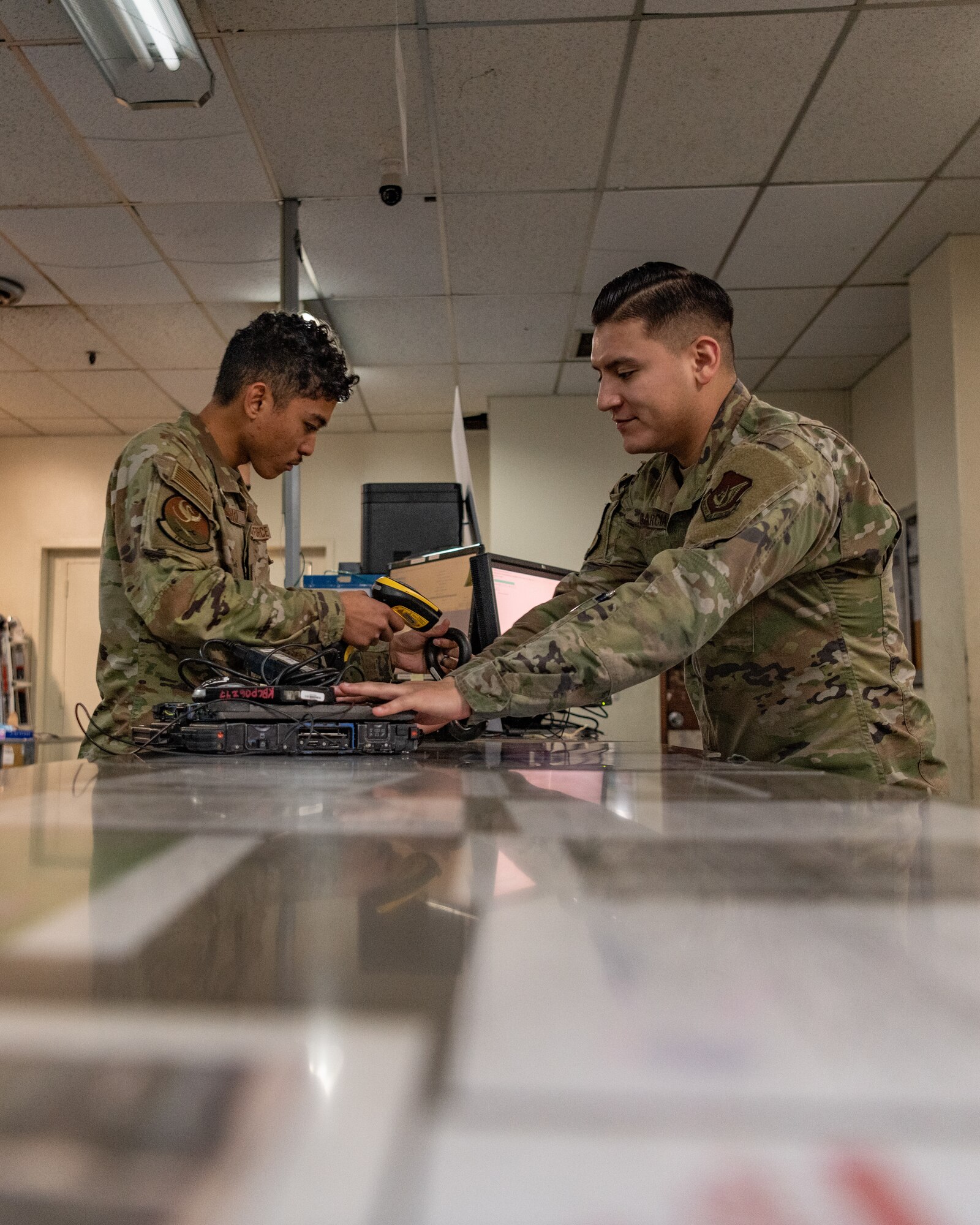 An Airman issues equipment to another Airman.