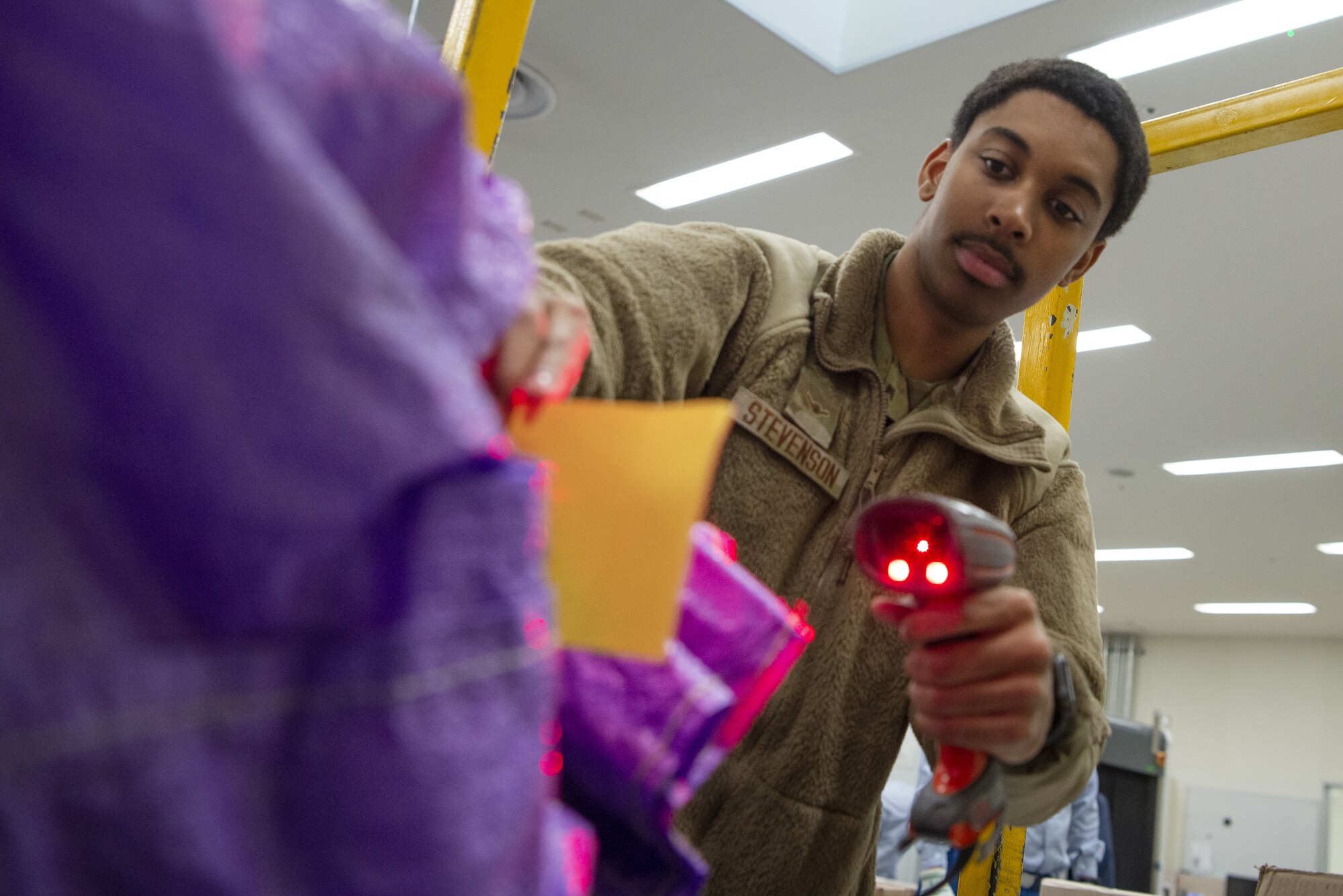 Airman Malik Singleton, Pacific Air Forces Air Postal Squadron mail processing clerk, scans mail for accountability Dec. 6, 2021, at Yokota Air Base, Japan. Members of the PACAF AIRPS integrate United States Postal Service and Government of Japan inspection policies into mail inspections for all mail destined for Yokota Air Base and Misawa Air Base. The squadron oversees operations for a transportation flight and 11 locations across the Pacific to serve more than 355,000 patrons across U.S. Indo-Pacific Command.