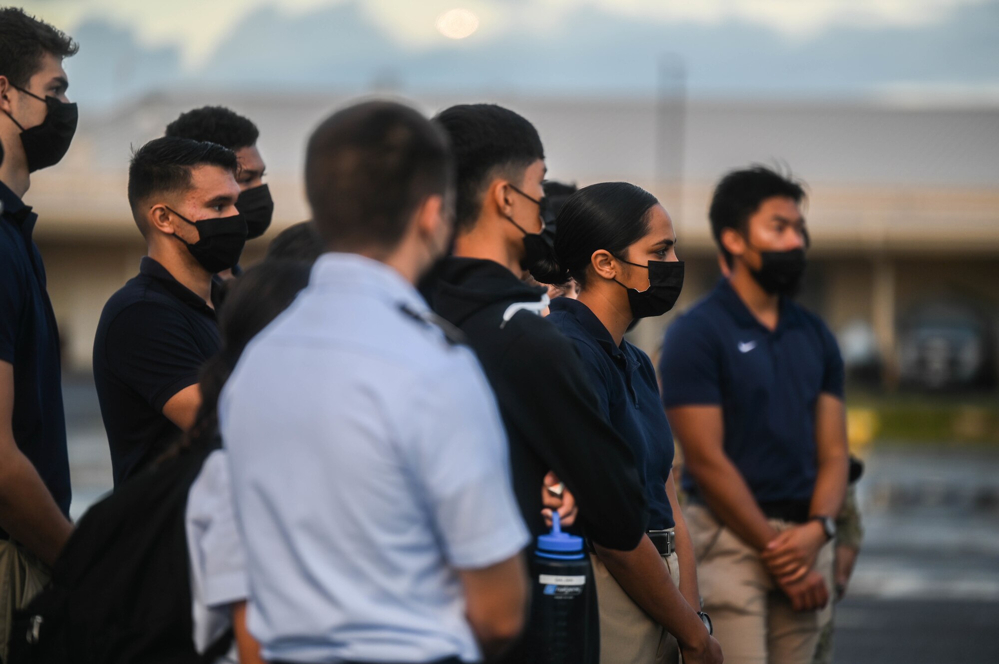 Cadets from the University of Hawaii Air Force Reserve Officer Training Corps listen to a briefing before entering a C-17 Globemaster III during a base tour at Joint Base Pearl Harbor-Hickam, Hawaii, Dec. 3, 2021. Guardsmen assigned to the 204th Airlift Squadron briefed UH ROTC cadets about C-17 and KC-135 Stratotanker operations. (U.S. Air Force photo by Staff Sgt. Alan Ricker)
