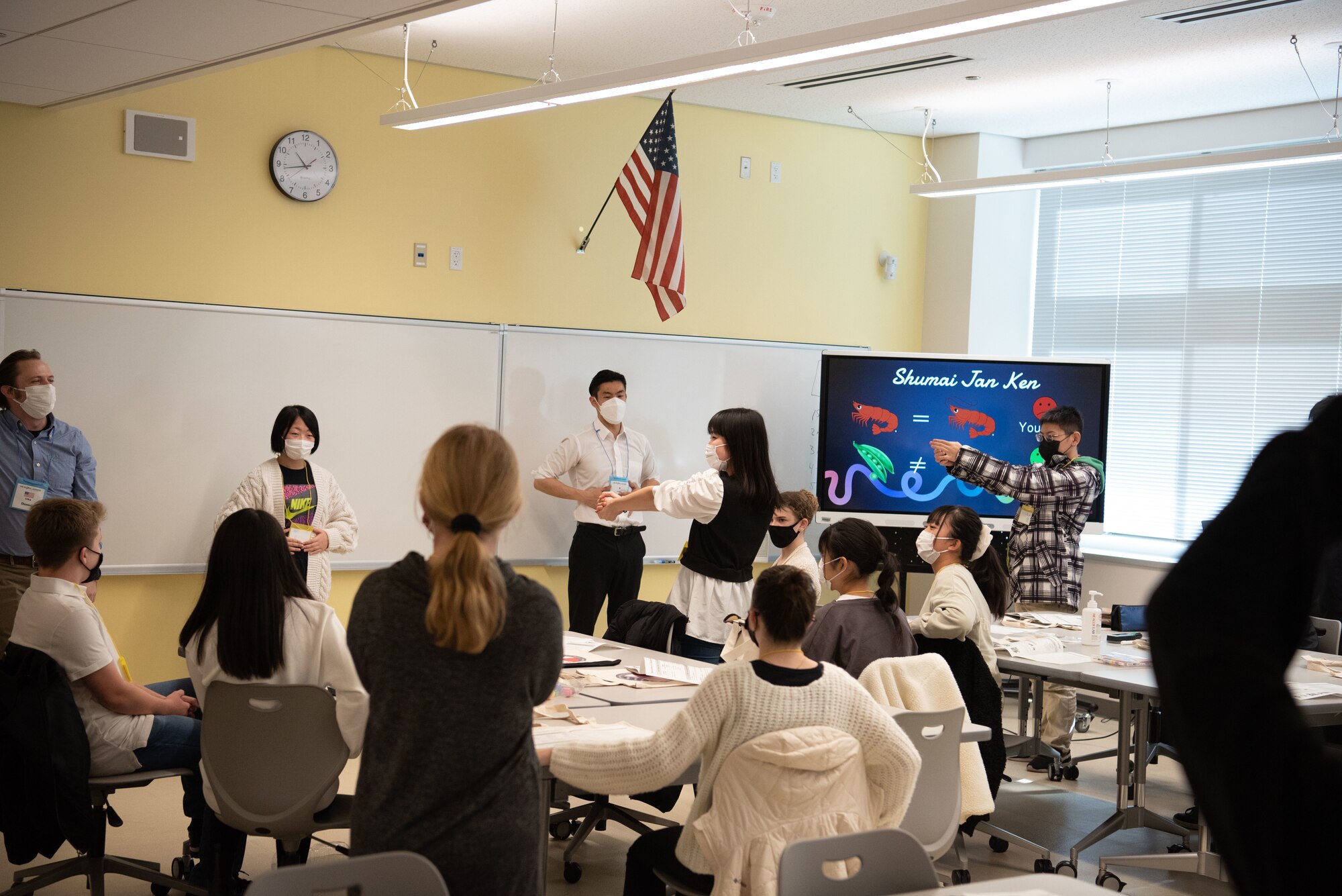 Students around the room play a game together.