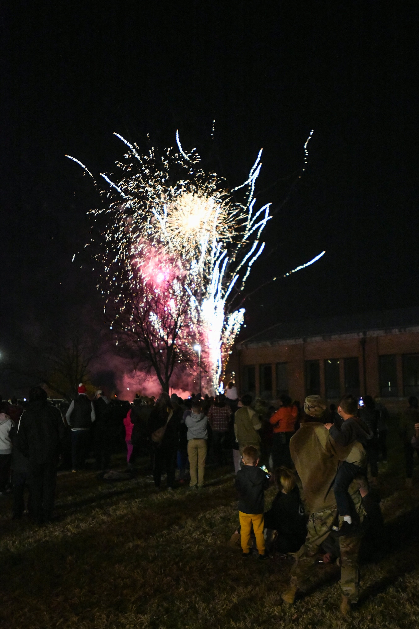 Fireworks go off after the Christmas tree and Hanukkah Menorah lighting ceremony during the annual Holiday Extravaganza hosted by Chapel 1 at Joint Base Andrews, Md., Dec. 2, 2021.