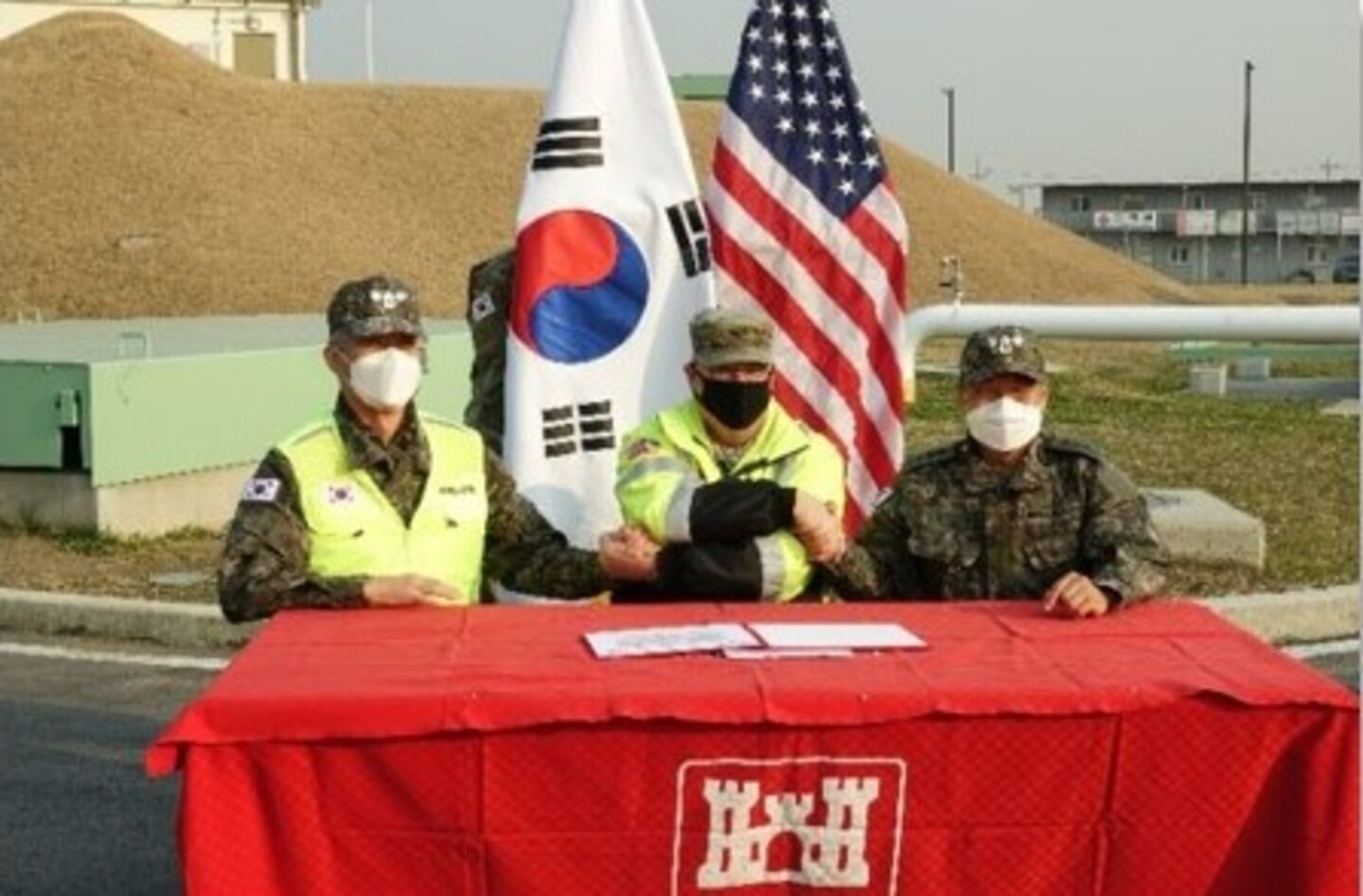 Col. Park Jong Yeon, Republic of Korea Design and Construction Agent Ministry of National Defense (ROKDCA MND DIA), Col. Garrett Cottrell, U.S. Design and Construction Agent (USDCA) and Col. Pyo In Tae, Republic of Korea Design and Construction Agent Ministry of National Defense, U.S. Forces Korea Relocation Office (ROKDCA MURO), signs the Acceptance Release Letter and Contractor Certificate of Appreciation during the ARL ceremony in Pyeongtaek, Republic of Korea, Dec. 7.