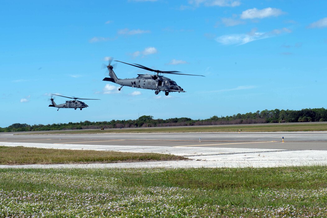 Two HH-60W Jolly Green IIs take off