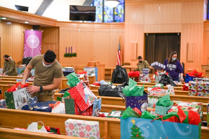 Volunteers sort and organize donated Angel Tree program gifts at the base chapel Dec. 9, 2021, at Hill Air Force Base, Utah. The base's Angel Tree program benefits military families anonymously nominated by the first sergeants. (U.S. Air Force photo by Cynthia Griggs)