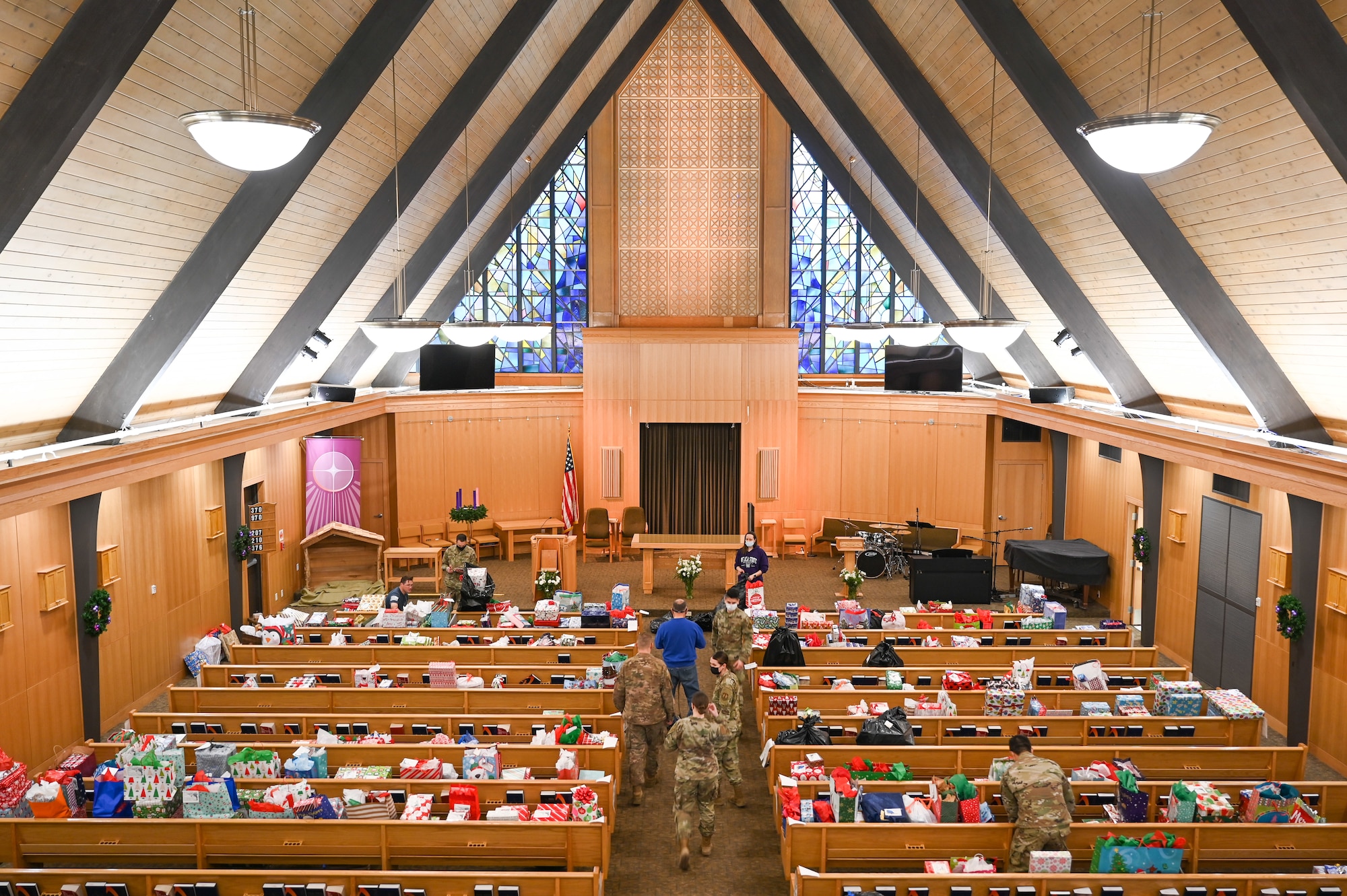 Volunteers sort and organize donated Angel Tree program gifts at the base chapel Dec. 9, 2021, at Hill Air Force Base, Utah. The base's Angel Tree program benefits military families anonymously nominated by the first sergeants. (U.S. Air Force photo by Cynthia Griggs)