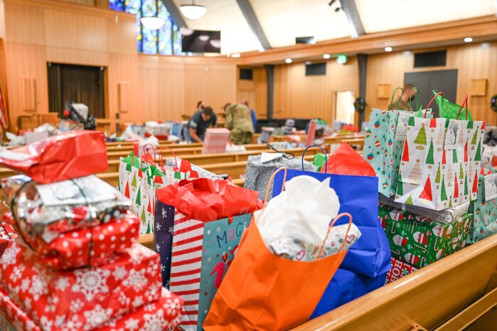 Volunteers sort and organize donated Angel Tree program gifts at the base chapel Dec. 9, 2021, at Hill Air Force Base, Utah. The base's Angel Tree program benefits military families anonymously nominated by the first sergeants. (U.S. Air Force photo by Cynthia Griggs)