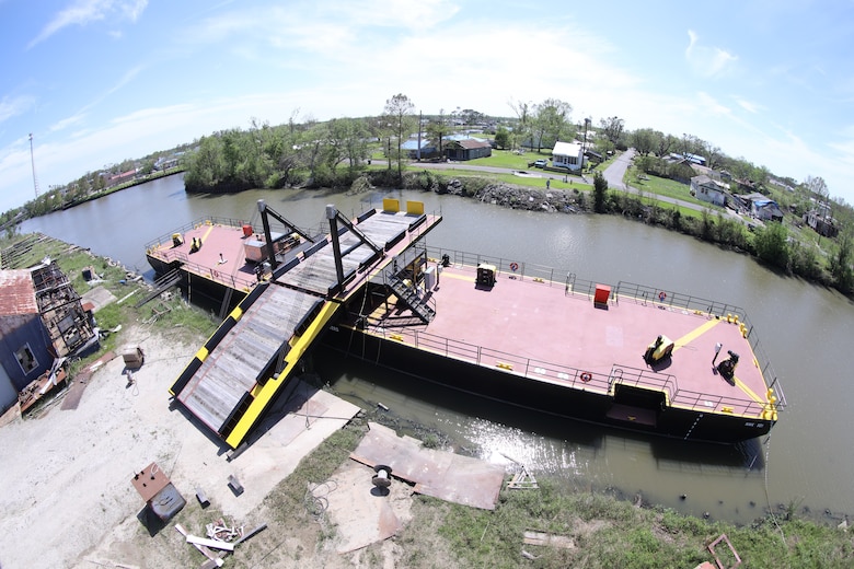 Photo shows a barge in a waterway