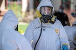 U.S. Air Force Capt. Margaret Mazzarello, 140th Wing medical personnel, Colorado National Guard Chemical, Biological, Radiological, Nuclear and high-yield (CBRNE) Enhanced Response Force Package (CERFP) team member, processes through the decontamination process after performing COVID-19 testing at a state veterans home in Aurora, Colorado, April 29, 2020.  At the direction of Governor Jared Polis, the Colorado CERFP assisted the state emergency operations center and Colorado Department of Public Health and Environment increase testing procedures and enabling state and local officials with an increased capability.  (U.S. Air National Guard photo by Senior Master Sgt. John Rohrer)