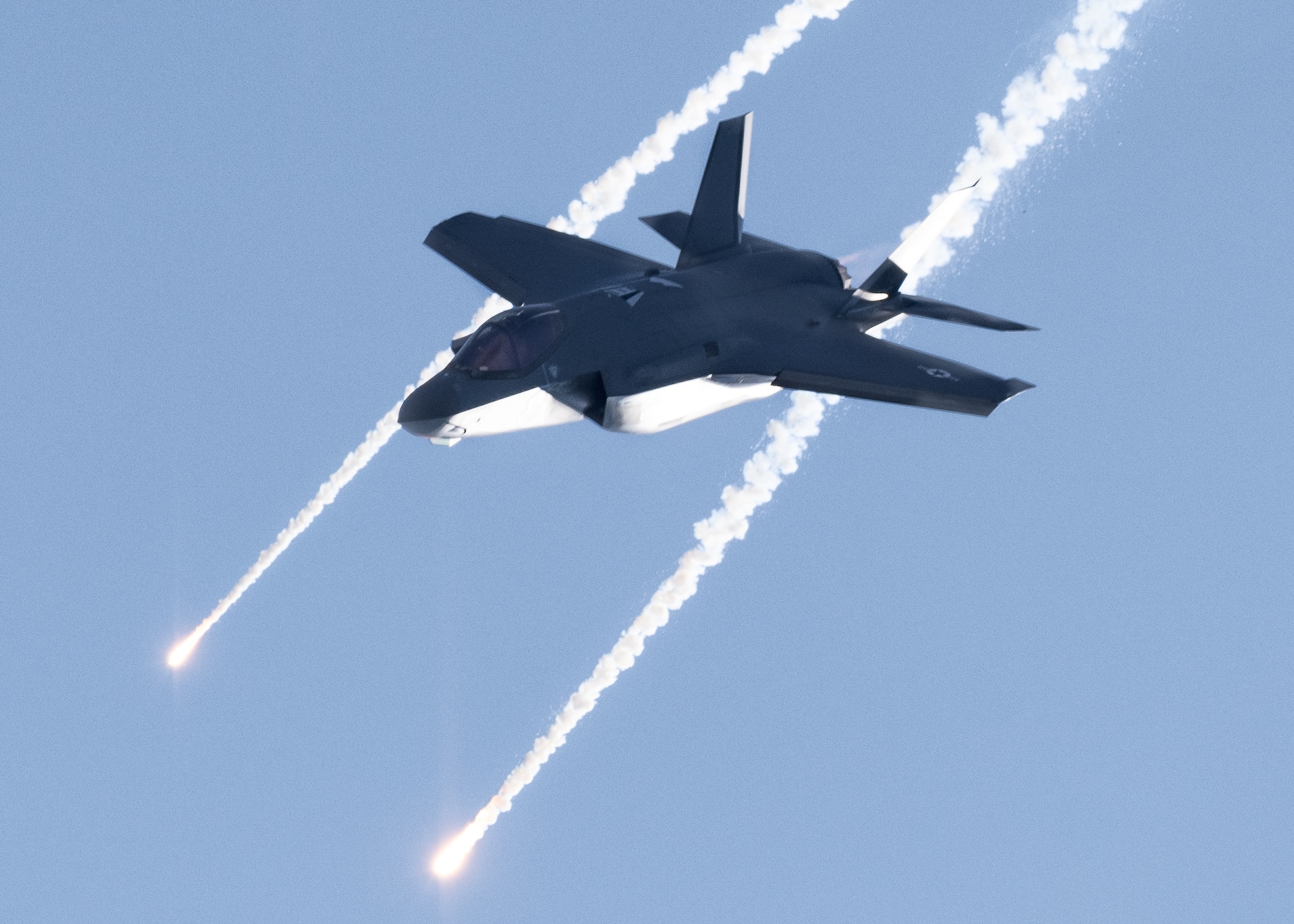 U.S. Air Force Maj. Kristin "BEO" Wolfe, F-35A Lightning II Demonstration Team pilot and commander, deploys flares during a demonstration rehearsal at the Pacific Air Show, Oct. 1, 2021, Huntington Beach, Calif.