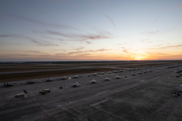 sun rises over flight line