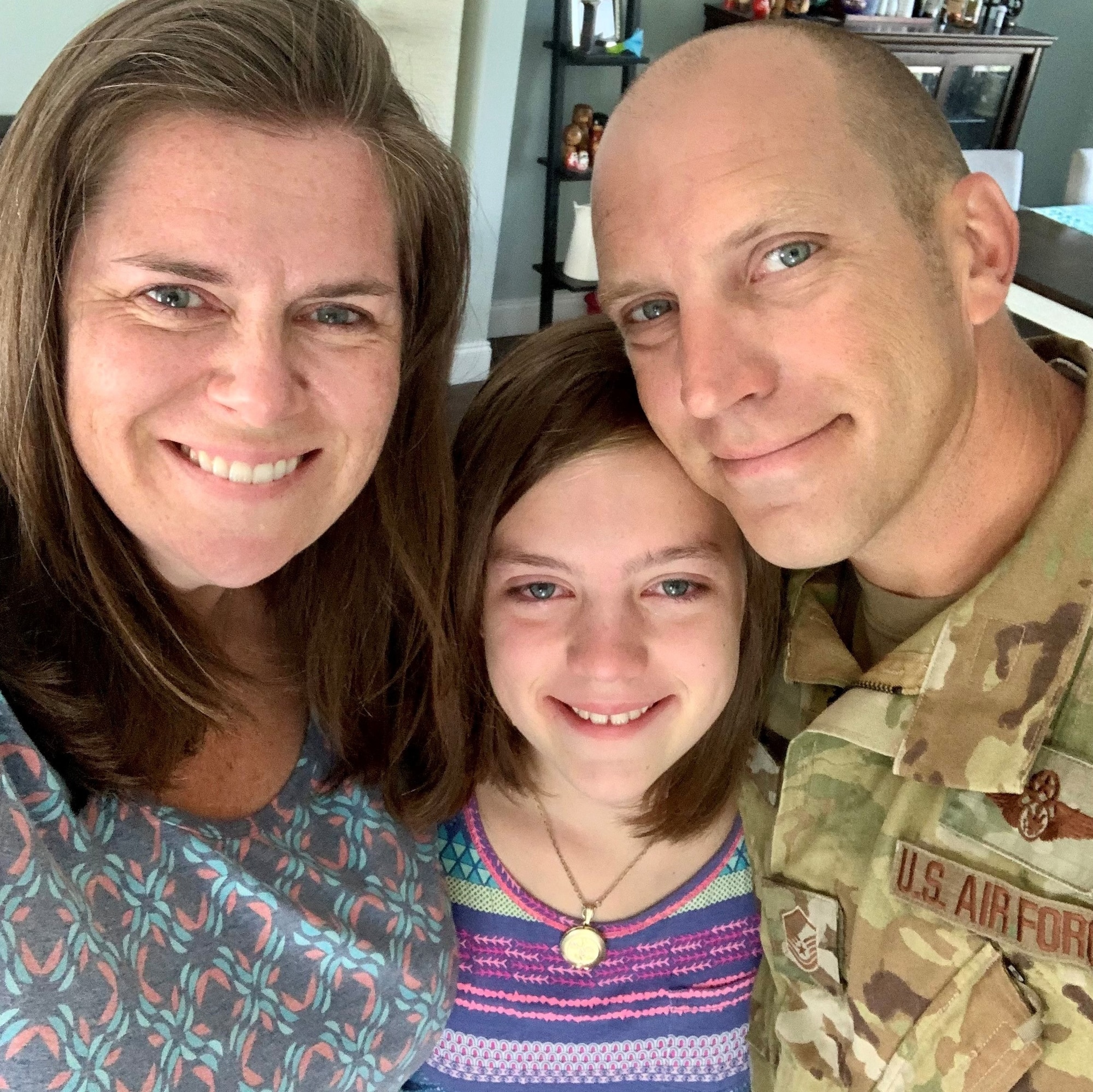 U.S. Air Force Master Sgt. Jonathan Lange, 321st Contingency Response Squadron contingency response team section chief, takes a photo with his family Aug. 14, 2021, at his home near Joint Base McGuire-Dix-Lakehurst, N.J., prior to deploying to Afghanistan. He deployed to Hamid Karzai International Airport in Kabul, Afghanistan, to support Operation Allies Refuge, where he served as the first sergeant for about 170 members from the 621st Contingency Response Wing and other Airmen who were forward deployed from other locations within U.S. Air Forces Central. (Courtesy photo)