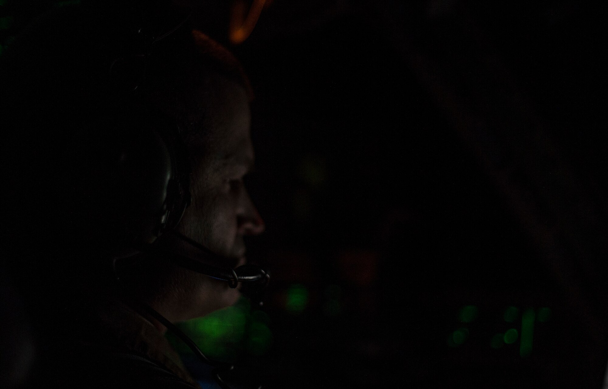 U.S. Air Force Col. Brian Collins, 62nd Airlift Wing vice commander, pilots a C-17 Globemaster III towards Glasgow Prestwick Airport in Prestwick, Scotland, Nov. 28, 2021. Collins was a part of an aircrew delivering new deployers to Al Udeid Air Base, Qatar, and returning Airmen whose deployment had ended. (U.S. Air Force photo by Staff Sgt. Tryphena Mayhugh)