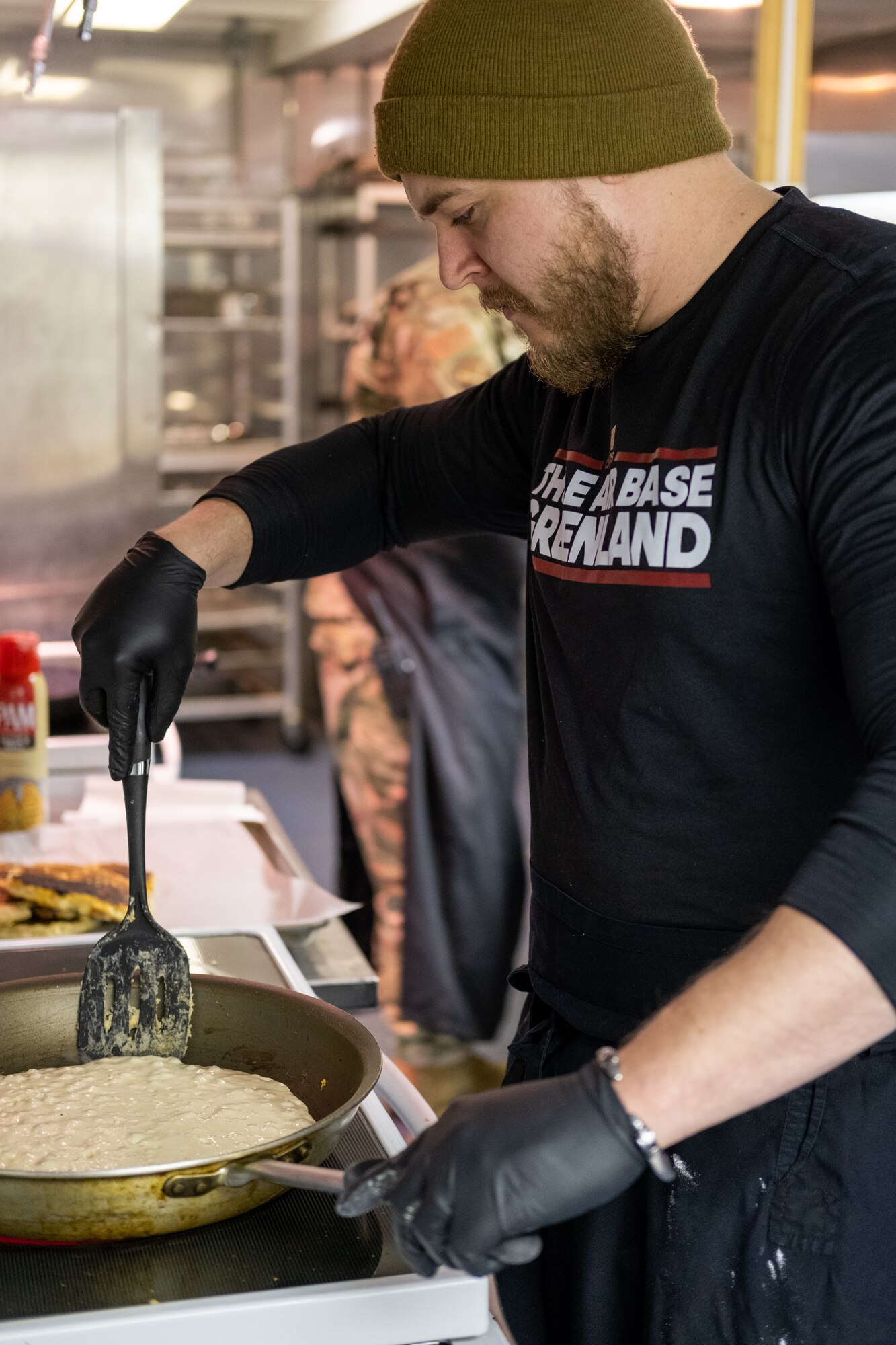 a man cooks a pancake