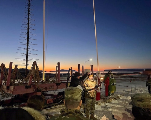 The 821st Air Base Group hosted their annual holiday tree-lighting ceremony at Thule Air Base, Greenland, Nov. 12, 2021. Nearly 150 members of Team Thule gathered in sub-zero temperatures to see the lighting of the base tree and star. (U.S. Air Force courtesy photo)