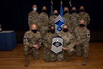 PETERSON SPACE FORCE BASE, Colo. – The newest U.S. Air Force and U.S. Space Force chief master sergeant selects pose for photo after the Peterson Space Force Base, Schriever SFB and Cheyenne Mountain Space Force Station release notifications at Peterson SFB, Colorado, Dec. 6, 2021.