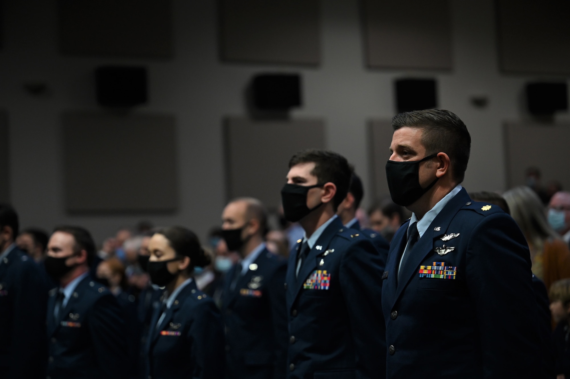 U.S. Air Force Maj. Benjamin Hammett, stands at attention during his Specialized Undergraduate Pilot Training graduation, Dec. 10, 2021, on Columbus Air Force Base, Miss. Hammett was one of three distinguished graduates from class 22-03 and also received the Air Education and Training Command Commander’s Trophy. (U.S. Air Force photo by Airman 1st Class Jessica Haynie)