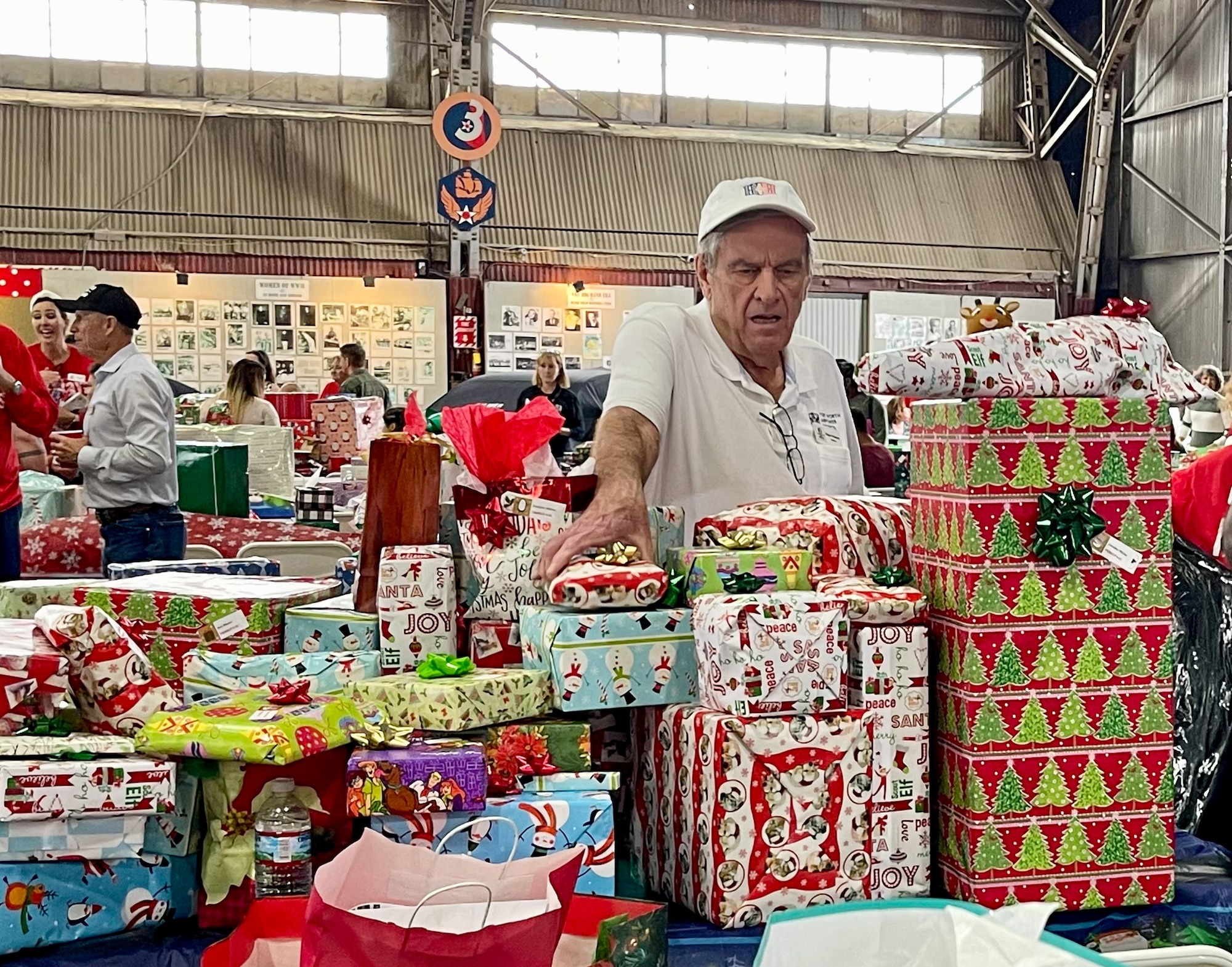 Members of the 301st Fighter Wing, along with wing senior leadership, participated in the sixth annual Holidays & Heroes community event at the Vintage Flying Museum in Fort Worth, Texas on Dec. 5, 2021.