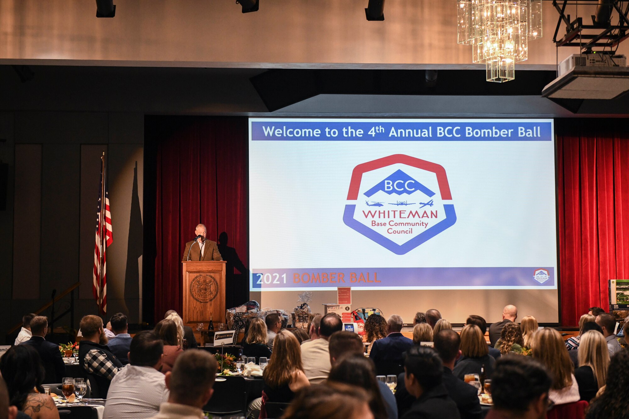 U.S. Air Force Col. Daniel Diehl, 509th Bomb Wing commander, gives remarks during the 4th Annual Bomber Ball at the University of Central Missouri, Warrensburg, Missouri, Nov. 12, 2021. The event celebrated the partnership between Team Whiteman and its 18 partnered communities and concluded with highlighting 18 Airmen whom the Whiteman Base Community Council sent home for the holidays. (U.S. Air Force photo by Staff Sgt. Sadie Colbert)