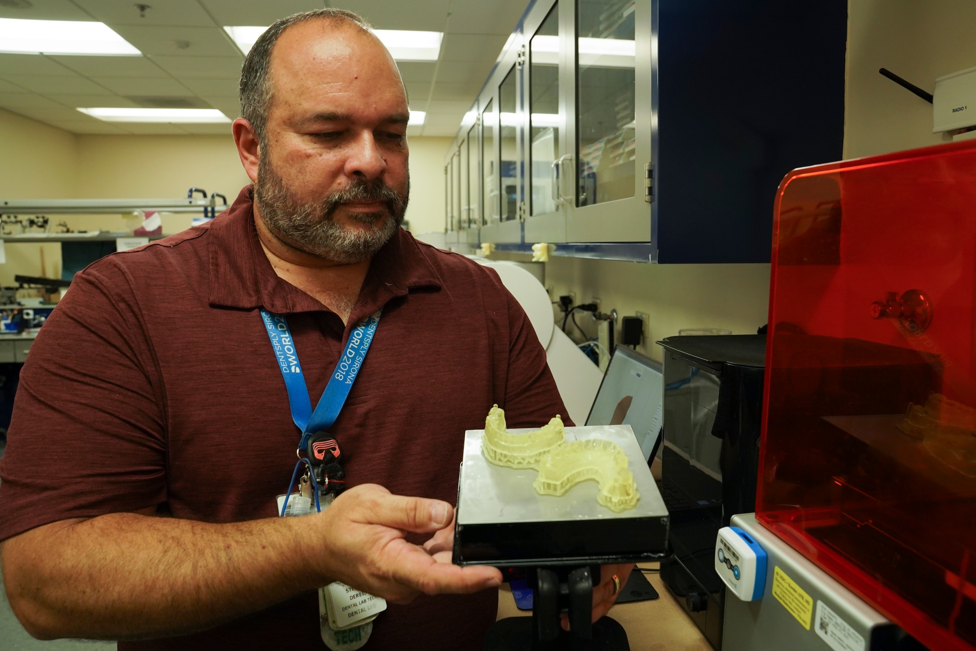 Stephen Deries, 81st Dental Squadron dental lab technician, demonstrates the technology used to make dentures inside Keesler Medical Center at Keesler Air Force Base, Mississippi, Oct. 4, 2021. In a partnership with the 81st Medical Diagnostics and Therapeutic Squadron’s radiation and oncology flight, Deries has found a way to create custom radiation boluses for cancer patients receiving radiation therapy. (U.S. Air Force photo by Senior Airman Spencer Tobler)