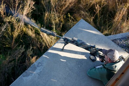 Staff Sgt. Philip Merlino, an infantryman with the Nebraska Army National Guard, fires his rifle Dec. 6, 2021, during the 51st Winston P. Wilson and 31st Armed Forces Skill at Arms Meeting Sniper Rifle Matches hosted by the National Guard Marksmanship Training Center at the Fort Chaffee Joint Maneuver Training Center, Barling, Arkansas.