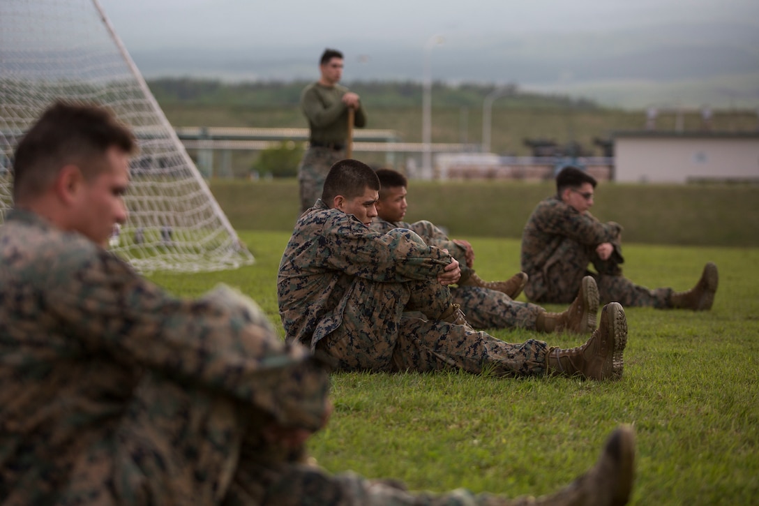 Marines stretch before executing techniques during a Marine Corps Martial Arts Program course May 3 aboard Combined Arms Training Center Camp Fuji, Japan. MCMAP is a continuously developing combat system that combines hand-to-hand and close quarter techniques with lessons on warrior ethos, leadership and teamwork. Due to the cold weather, the Marines take extra time to warm up and stretch before executing the mentally and physically taxing missions they are assigned during MCMAP.