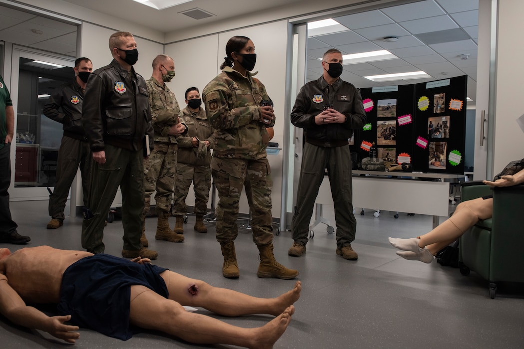 The medical center shows off their new training room for tactical combat casualty care with their dummies for training displayed for a group  of Airmen