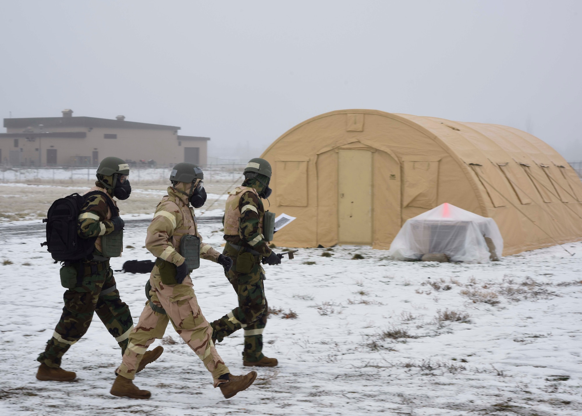 92nd Civil Engineer Squadron Airmen perform a post-attack reconnaissance team sweep during a large-scale readiness exercise at Fairchild Air Force Base, Washington, Dec. 7, 2021. This LRE provided Fairchild the opportunity to train and test multi-capable Airmen concepts, contingency response operations as well as agile combat employment initiatives. (U.S. Air Force photo by Airman 1st Class Anneliese Kaiser)