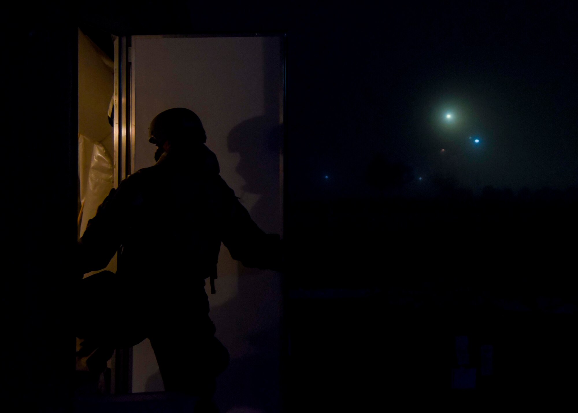 A 92nd Civil Engineer Squadron Airman walks into a tent during a large-scale readiness exercise at Fairchild Air Force Base, Washington, Dec. 7, 2021. This LRE provided Fairchild the opportunity to train and test multi-capable Airmen concepts, contingency response operations as well as agile combat employment initiatives. (U.S. Air Force photo by Airman 1st Class Anneliese Kaiser)