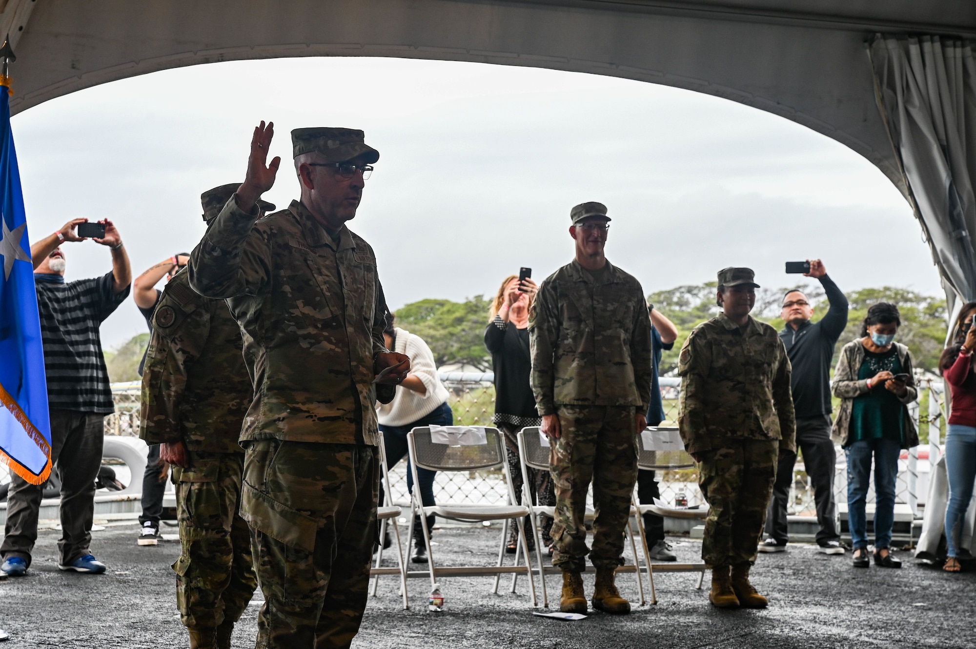 Maj. Gen. Ed Thomas, Commander, Air Force Recruiting Service,, administers the Oath of Enlistment during a total force enlistment ceremony aboard the Battleship Missouri Memorial on Ford Island, Hawaii, Dec. 6, 2021. Thomas administered the oath for active-duty, reserve and Space Force recruits, while Brig. Gen. Joseph R. Harris II, Hawaii Air National Guard commander, administered the oath for HIANG recruits. (U.S. Air Force photo by Staff Sgt. Alan Ricker)