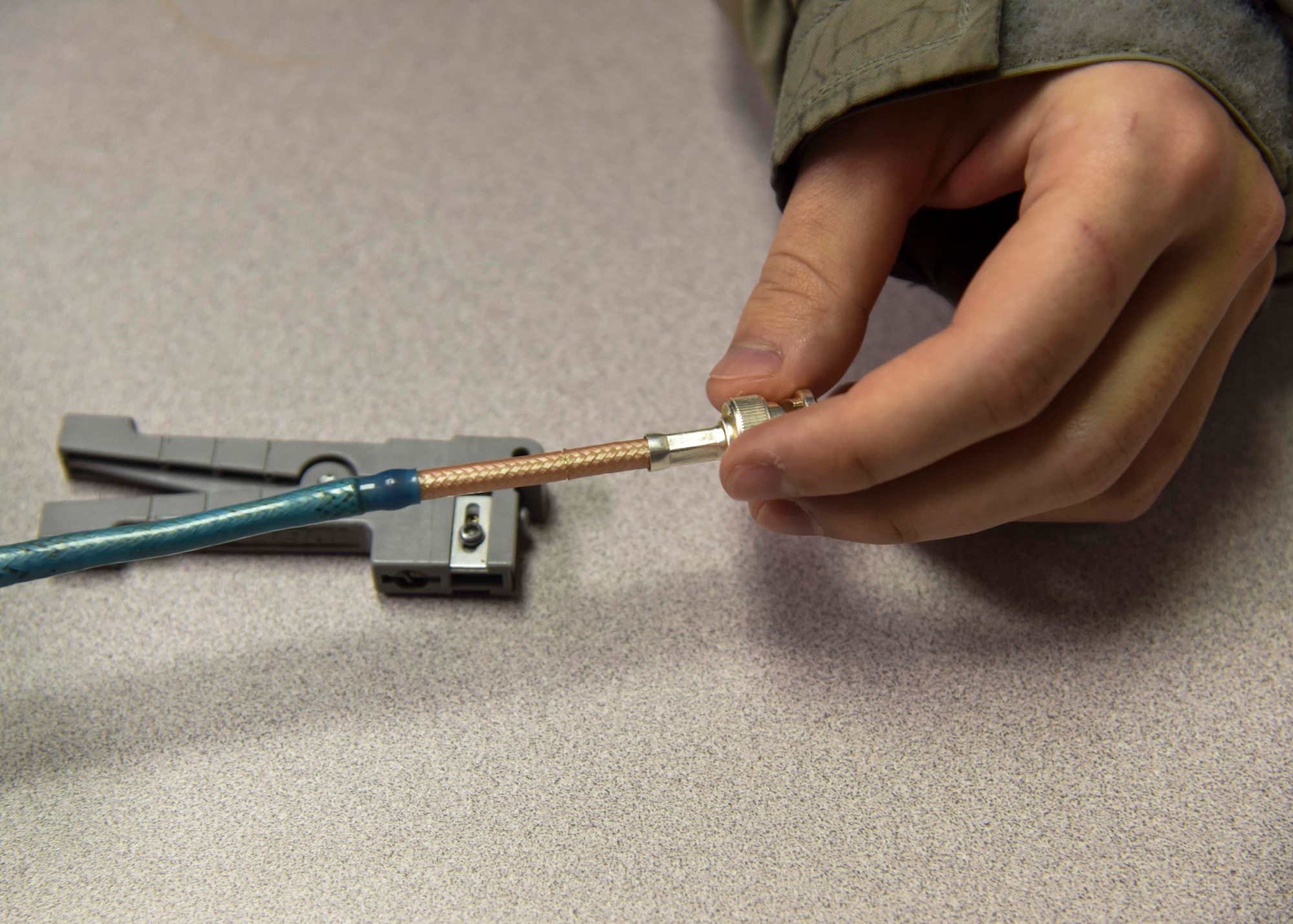 A U.S. Air Force Airman learns how to secure a KC-135 Stratotanker radio wire during a communication navigation systems course at Fairchild Air Force Base, Washington, Dec. 6, 2021. This relatively new training includes an auxiliary power unit and quality standards system class, boom hydraulic class and an air crew servicing class, with key lessons on safety, reading technical orders, and troubleshooting methods. (U.S. Air Force photo by Airman 1st Class Anneliese Kaiser)