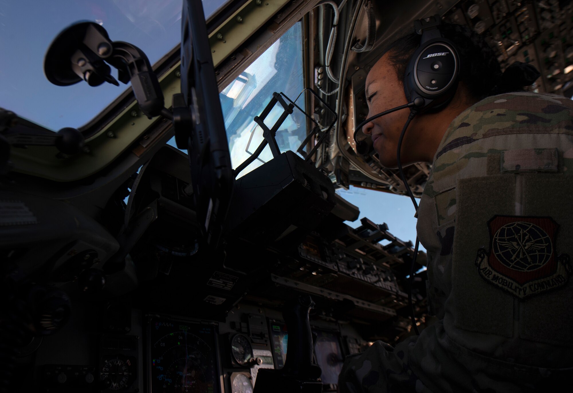 U.S. Air Force 1st Lt. Erica Drakes, 4th Airlift Squadron pilot, flies a C-17 Globemaster III carrying Airmen assigned to Joint Base Lewis-McChord, Washington; Joint Base McGuire-Dix-Lakehurst, New Jersey; and Dover Air Force Base, Delaware, deploying to the 816th Expeditionary Airlift Squadron at Al Udeid Air Base, Qatar, Nov. 28, 2021. Periodically throughout the year, C-17 squadrons within Air Mobility Command send Airmen to Al Udeid to perform airlift missions in the Allied Forces Central Europe area of responsibility. (U.S. Air Force photo by Staff Sgt. Tryphena Mayhugh)