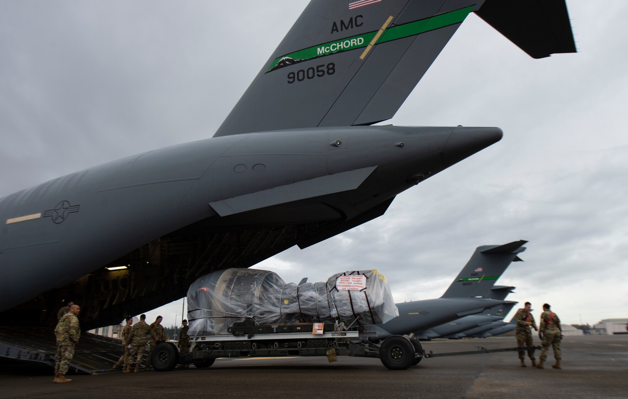 A C-17 Globemaster III jet engine is loaded onto a C-17 at Joint Base Lewis-McChord, Washington, Nov. 27, 2021. The jet engine was being delivered to Joint Base McGuire-Dix-Lakehurst, New Jersey, during the 816th Expeditionary Airlift Squadron deployment swap out at Al Udeid Air Base, Qatar. 
(U.S. Air Force photo by Staff Sgt. Tryphena Mayhugh)