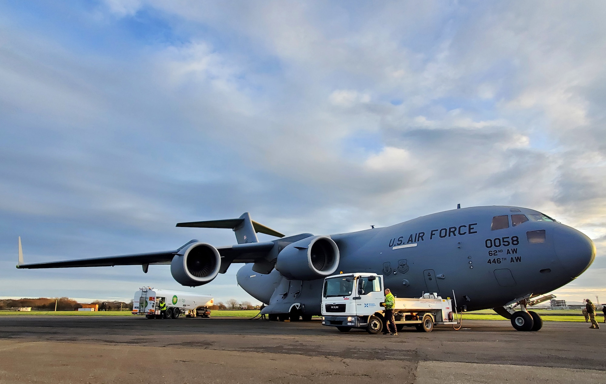 A C-17 Globemaster III assigned to Joint Base Lewis-McChord, Washington, sits on the flightline at Glasgow Prestwick Airport in Prestwick, Scotland, Dec. 2, 2021. U.S. Airmen assigned to JBLM, Joint Base McGuire-Dix-Lakehurst, New Jersey and Dover Air Force Base, Delaware, were transported back to the U.S. on the C-17 after being deployed at Al Udeid Air Base, Qatar, for several months. (U.S. Air Force photo by Staff Sgt. Tryphena Mayhugh)