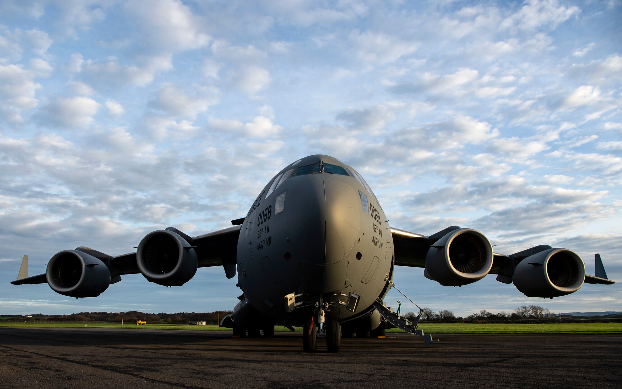 A C-17 Globemaster III assigned to Joint Base Lewis-McChord, Washington, sits on the flightline at Glasgow Prestwick Airport in Prestwick, Scotland, Dec. 2, 2021. U.S. Airmen assigned to JBLM, Joint Base McGuire-Dix-Lakehurst, New Jersey and Dover Air Force Base, Delaware, were transported back to the U.S. on the C-17 after being deployed at Al Udeid Air Base, Qatar, for several months. (U.S. Air Force photo by Staff Sgt. Tryphena Mayhugh)