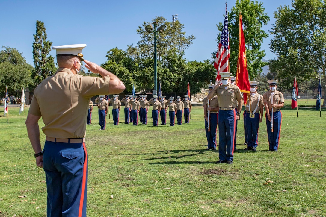 U.S. Marine Corps Maj. Christopher O'Melia, right, outgoing Commanding Officer, Recruiting Station Los Angeles, salutes Maj. Cole W. Lapierre, incoming Commanding Officer, Recruiting Station Los Angeles, during the Change of Command Ceremony at the Rose Bowl Stadium in Pasadena, California, June 10, 2021. The Change of Command Ceremony represents the official passing of authority from the outgoing commander to the incoming commander. (U.S. Marine Corps photo by Cpl. Stephanie E. Soto)