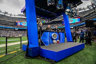 EAST RUTHERFORD, N.J. (Dec. 11, 2021) Chief of Naval Operations (CNO) Adm. Mike Gilday, right, and Chief of Staff of the Army Gen. James McConville, center, are interviewed by CBS Sports before the 122nd Army-Navy Football Game. (U.S. Navy photo by Mass Communication Specialist 1st Class Sean Castellano/Released)