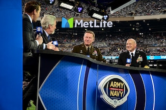 EAST RUTHERFORD, N.J. (Dec. 11, 2021) Chief of Naval Operations (CNO) Adm. Mike Gilday, right, and Chief of Staff of the Army Gen. James McConville, center, are interviewed by CBS Sports before the 122nd Army-Navy Football Game. (U.S. Navy photo by Mass Communication Specialist 1st Class Sean Castellano/Released)