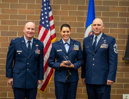 U.S. Air Force Capt. Katie Lunning, 133rd Medical Group, accepts the Outstanding Airman of the Year award for the company grade officer of the year in St. Paul, Minn., Dec. 11, 2021.