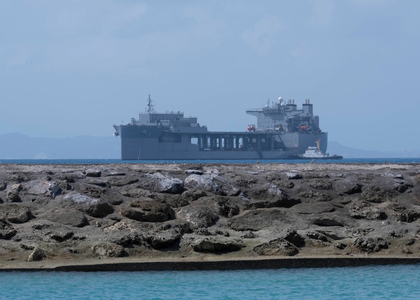 Lewis B. Puller-class expeditionary staging base USS Miguel Keith (ESB 5) anchors off Commander, Fleet Activities Okinawa White Beach Naval Facility Oct. 6, 2021. Miguel Keith, assigned to Amphibious Squadron Eleven, is operating in the U.S. 7th Fleet area of responsibility to enhance interoperability with allies and partners and serve as a ready response force to defend peace and stability in the Indo-Pacific region.