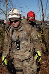Army Guardsmen with the 301st Chemical Battalion and Air Guardsmen with the 123rd Airlift Wing continue search and rescue missions in Mayfield, Ky., Dec. 12, 2021. Tornadoes killed dozens of people and caused extensive damage in the area.