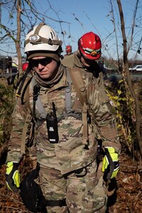 Army Guardsmen with the 301st Chemical Battalion and Air Guardsmen with the 123rd Airlift Wing continue search and rescue missions in Mayfield, Ky., Dec. 12, 2021. Tornadoes killed dozens of people and caused extensive damage in the area.