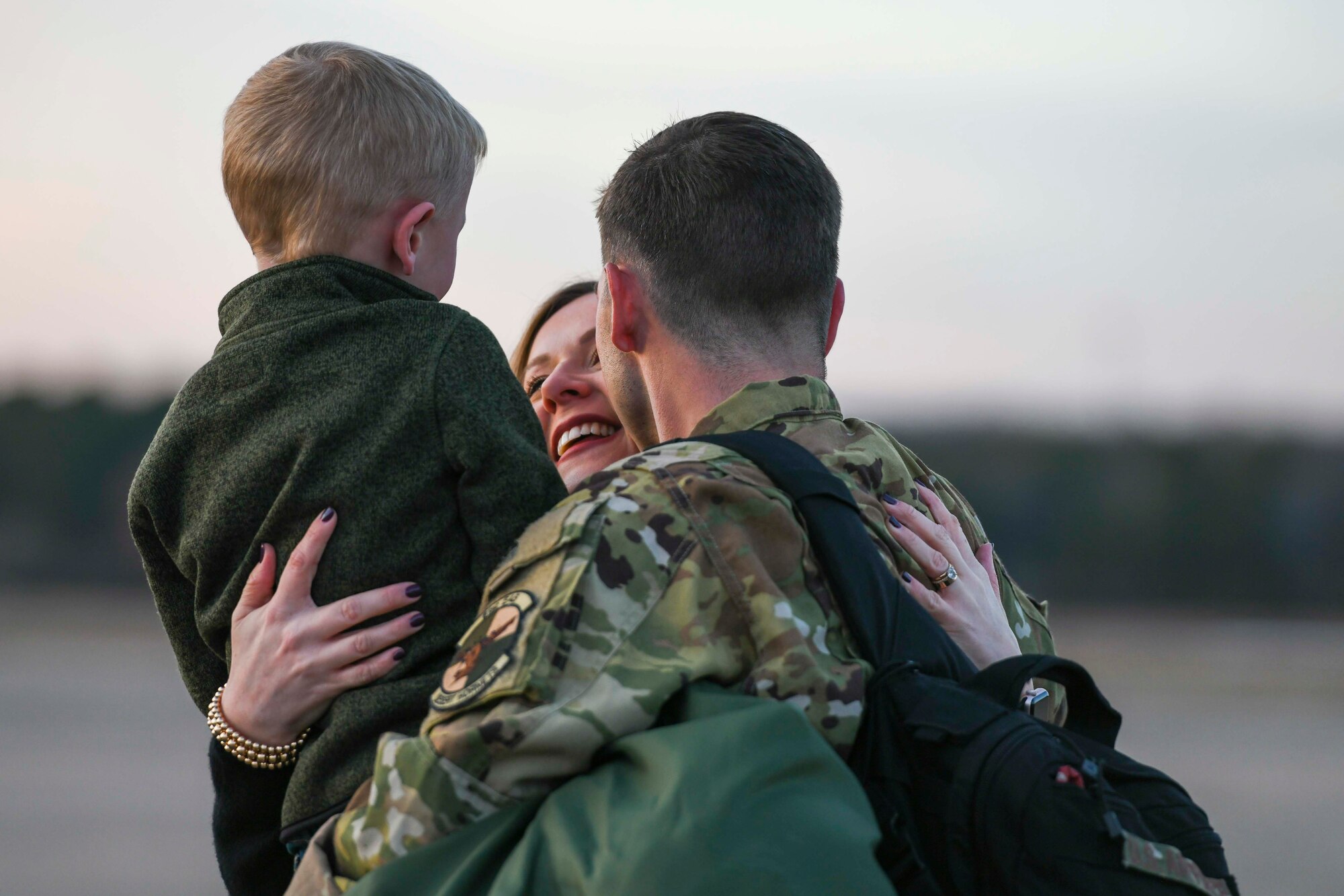 An Airman greets his family upon returning from deployment.