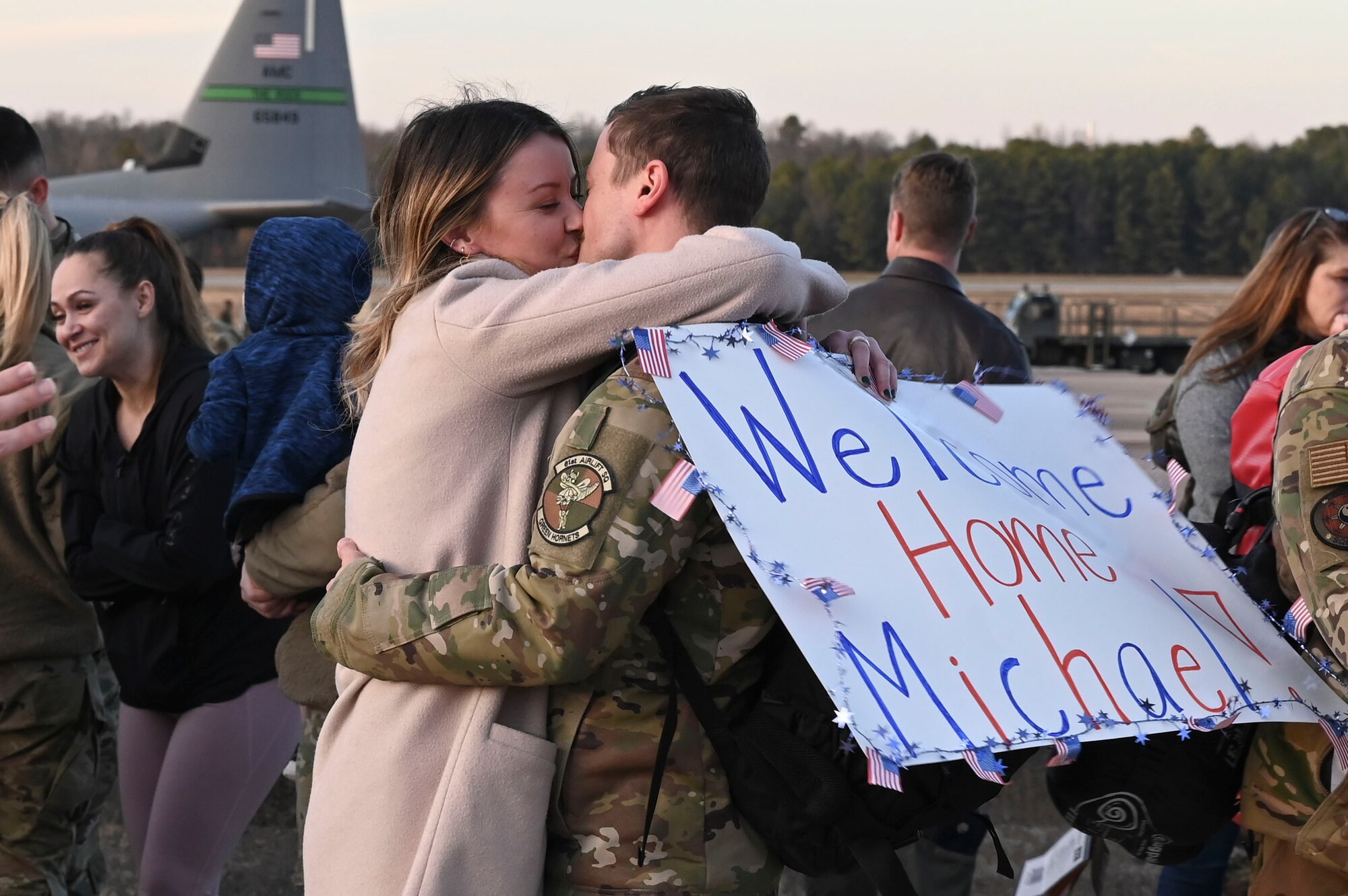 An Airman greets his wife upon returning form deployment.