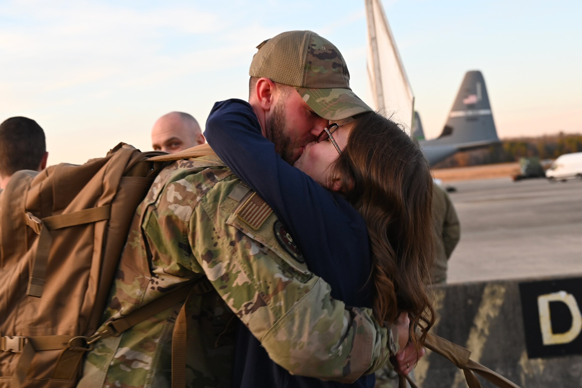 An Airmen greets his wife upon returning from deployment.