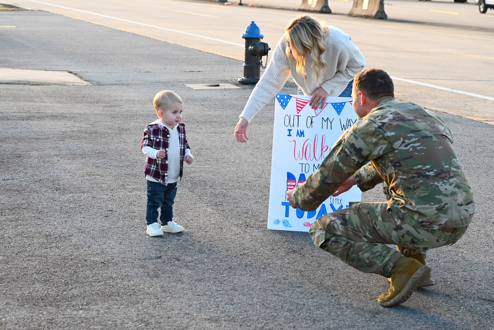 An Airmen greets his son upon returning from deployment.