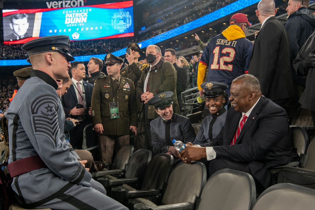 Secretary of Defense Lloyd J. Austin III speaks with U.S. Military Academy cadets in a stadium.