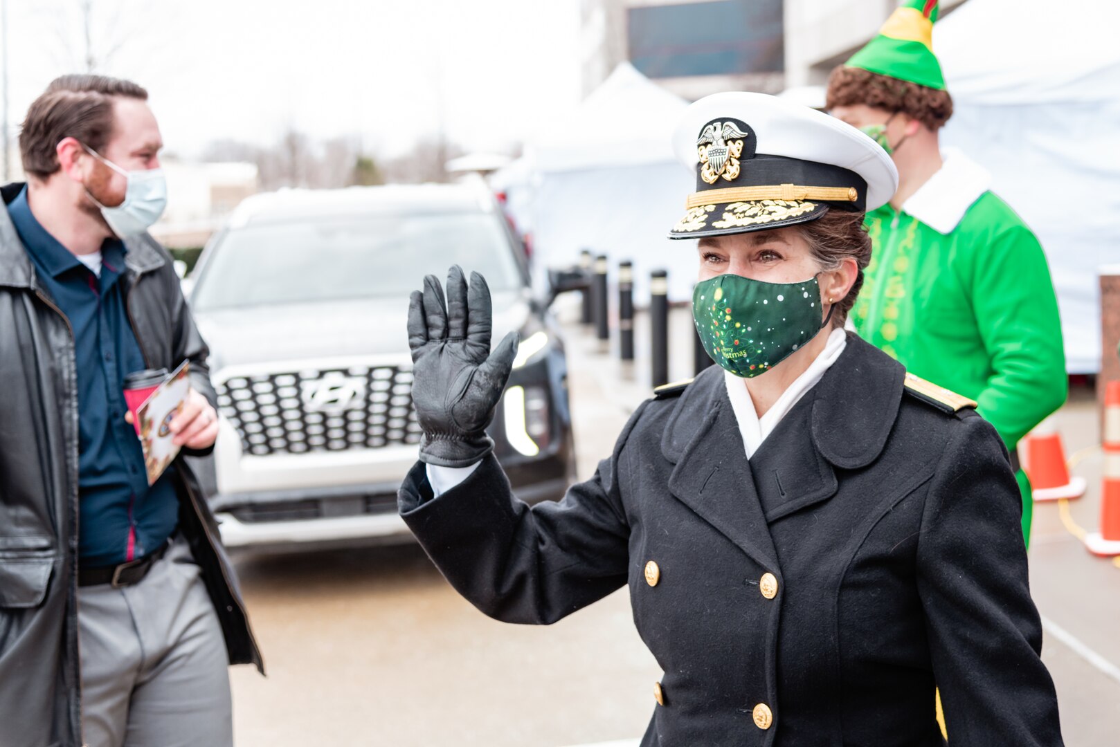 DLA Land and Maritime Commander Navy Rear Adm. Kristen Fabry waves to associates.