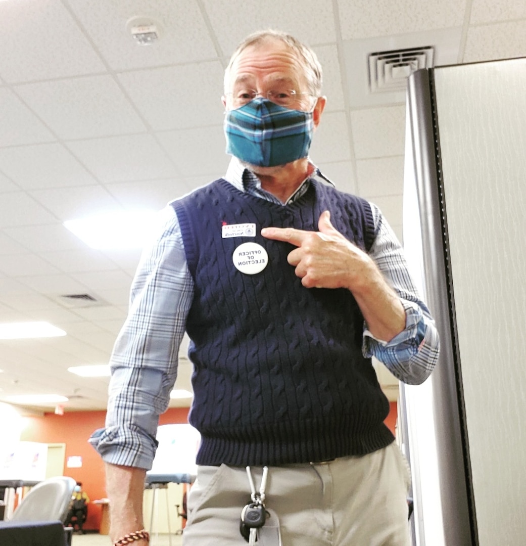 Rick Dollar volunteers his time at an election polling station.