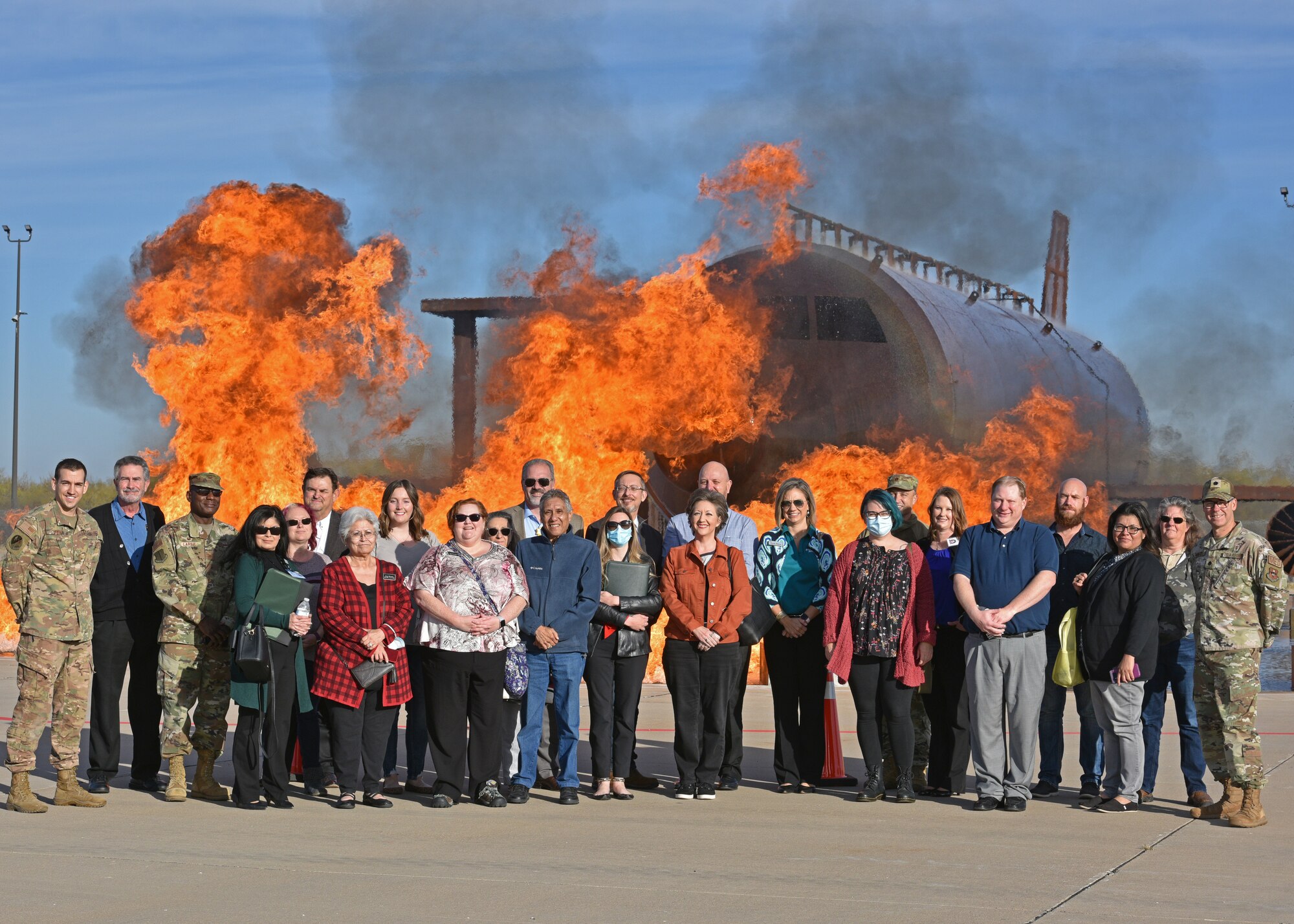 Local mental health providers and 17th Training Wing members pose for a photo during an open house on Goodfellow Air Force Base, Texas, Dec. 3, 2021. The 17th Medical Group hosted an open house to help the providers thoroughly understand military members' stress and strain in their day-to-day lives. (U.S. Air Force photo by Senior Airman Ashley Thrash)