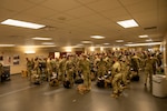 Members of the Colorado Army National Guard 3rd Battalion, 157th Field Artillery Regiment prepare to deploy in support of Operation Spartan Shield Dec. 6, 2021, at the Colorado Springs Airport. Their mission, in support of U.S. Central Command, is essential in demonstrating the United States’ commitment to the security and stability of our partners in the Middle East and Central Asia. (U.S. Army National Guard photo by Capt. Remington Henderson)